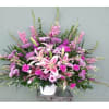 This beautiful arrangement with its purple and pink flowers reminds us that