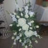 Spray includes a beautiful arrangement of white flowers including hydrangeas, roses, glads