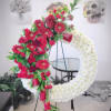 Garland made of white coushiun, roses, gerberas and red carnations