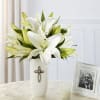 The symbolic white lily shares meaningful messages with your loved ones during