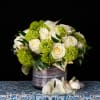 This artistic arrangement consist of viburnum ,roses and ivy 

 Make a