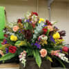 A full and big arrangement of mixed flowers for the center of