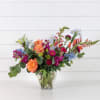 Traditional garden style arrangement in a bright striking pallett