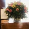 A 10x10 cylinder vase with yellow stock pink garden 2 dozen roses