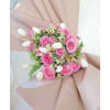 tulips, roses and greens in a beautiful hand wrapped bouquet. 