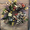 A silk medium Wreath. Approximately 24&rdquo;-26&rdquo; in size. Beautifully designed with real