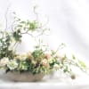 For the artist.  Sculptural, a-symmetrical boat with natural and seasonal elements