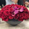 60 stem bacara burgundy roses in a modern round vase  