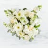This arrangement contains a mixture of white and cream focal flowers along