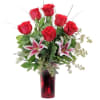 Stargazor lilies and roses, Deluxe has a dozen roses.
