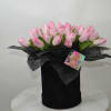 Box with cute pink tulips