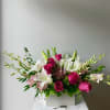  A wildly sophisticated array of pale pink roses and lilies with