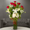 A classic arrangement of twelve long stem premium roses arranged in a