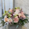 Rustic box with roses, filler, carnations, orchids, and greenery. 