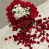 Long stem roses in a heart shaped bouquet tied with a satin