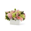 The true beauty in this arrangement is in the soft hues, sweet