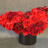 Red Roses and Sweet William completes this beautiful arrangement.