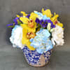 In a beautiful Chinese vase, Yellow Cymbidium, White Lisianthus, and Hydrangeas. 