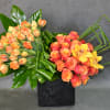Wow, Roses and tulips with a touch of cymbidium orchids, just perfect.