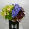 Assorted flowers, orchids, hyndrengeas and green dianthus. 
