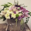Gold Box with an arrangement of mixed flowers in white and purple