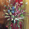 large spray with hydrangea Starfire, orchids, cherry blossoms, and passion flower.