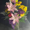 Pink Lilies arranged with a mix of purple and yellow flowers arranged