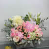 A sweet and fragrant arrangement of blush colored flowers. A mixture of