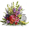 A rainbow of reverence. This uplifting arrangement of lilies, roses and snapdragons