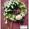 A gorgeous arrangement of flowers detailed with a cluster of lilies and