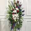 A beautiful standing spray with a modern design consisting of red, white
