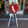 A solid red rose standing spray 