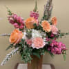 Beautiful mixture of pinks, whites, and peach tones, with seasonal florals 