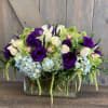 this lush and calming arrangement is full of Hydrangea, Roses, Cymbidium Orchids