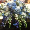 A variety of blue and white flowers for the top of the