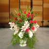 PODIUM ARRANGEMENT BY BY TWIN TOWERS FLORIST

    As Shown