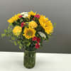 This happy arrangement is housed in a quaint mason jar, giving the