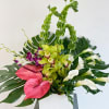 A tropical knockout. Green Cymbidium, White Cala Lily, and Anthuriums surrounded by
