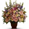 A warm and peaceful bounty of pastel blossoms gently expresses love and