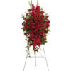 This rich, radiant spray of red roses, gladioli and other popular red