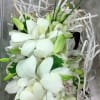 Dendrobium Orchids accented with rhinestones, various foliage, and your choice color of