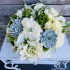 This one of a kind design white rare arrangement with succulents moss
