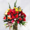 Assorted color Ecuadorian roses with accents in a tall glass vase
STANDARD: FIRST