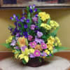 Bright and beautiful basket with bright yellows, deep purples accented with lavender