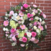 WREATH WITH A VARIETY OF PASTEL PINKS, GREENS AND WHITES

