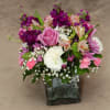 A lovely combination of lavender roses, pink mini carnations, purple stock, alstromeria