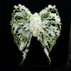Open lattice angel wings on a standing easel.