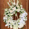 Wreath made with all white Lilys , Roses , Hydrangeas , Stock