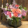 Our artisan handmade arrangement&#039;s overall theme is different shades of pink. The
