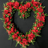 Assorted red sweet flowers for your loved one&#039;s wreath. Flower types will